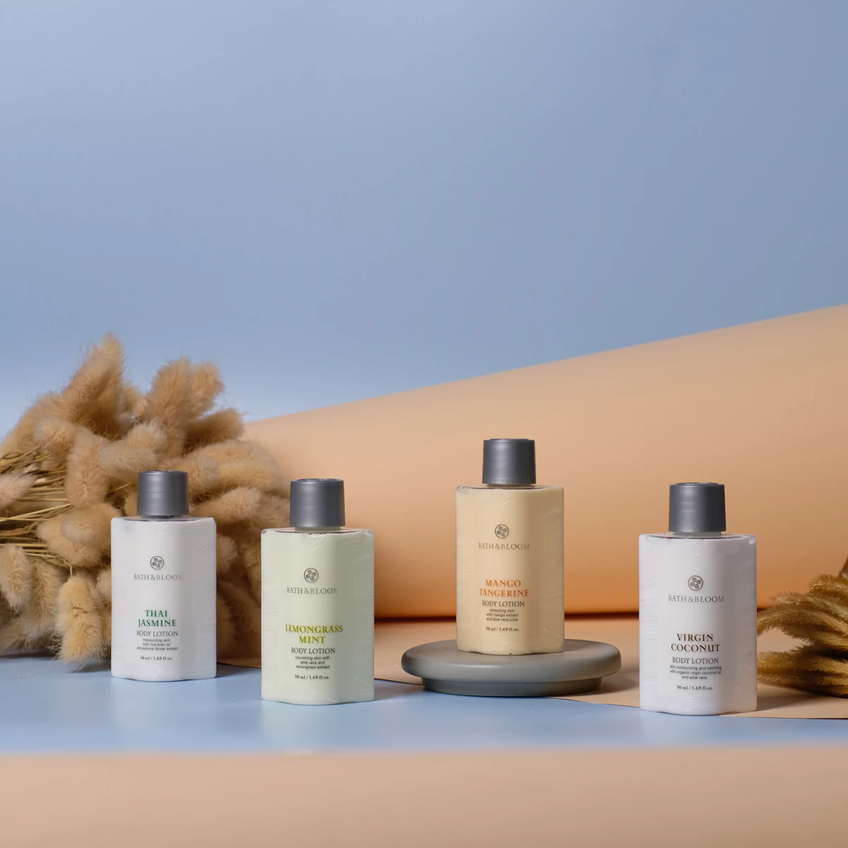 Our body lotion features natural fragrances including Thai jasmine, lemongrass mint, mango tangerine, and coconut. Each scent helps nourish and care for your skin while offering an aromatherapeutic scent that promotes relaxation. Available in a convenient 50 ml travel size. Our body lotion features natural fragrances including Thai jasmine, lemongrass mint, mango tangerine, and coconut. Each scent helps nourish and care for your skin while offering an aromatherapeutic scent that promotes relaxation. Available in a convenient 50 ml travel size.