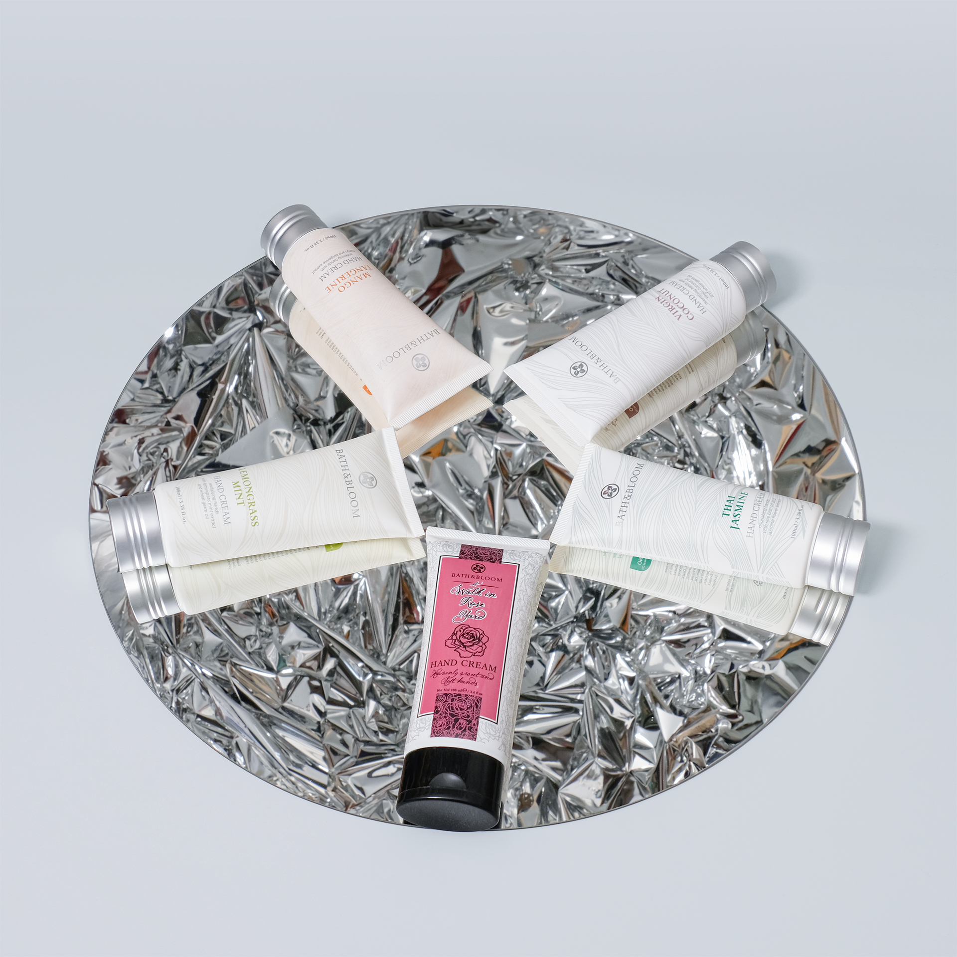 Our nourishing hand and nail cream is available in a variety of natural scents, including Thai jasmine, Lemongrass Mint, Mango Tangerine, Coconut, Rose, and blends infused with eucalyptus and tea tree essential oils. Each unique fragrance not only pampers your skin but also uplifts your mood, offering a soothing aromatherapy experience that promotes relaxation and emotional well-being. Our nourishing hand and nail cream is available in a variety of natural scents, including Thai jasmine, Lemongrass Mint, Mango Tangerine, Coconut, Rose, and blends infused with eucalyptus and tea tree essential oils. Each unique fragrance not only pampers your skin but also uplifts your mood, offering a soothing aromatherapy experience that promotes relaxation and emotional well-being.